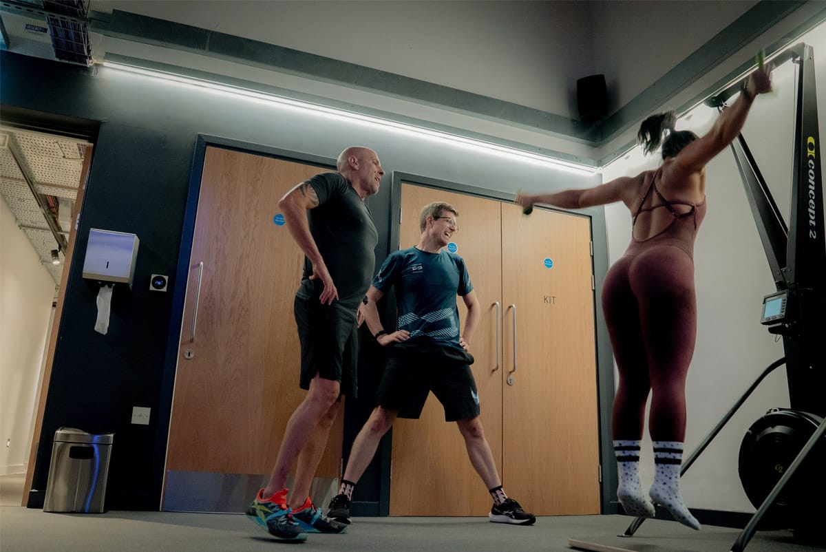 three gym users in a workout class