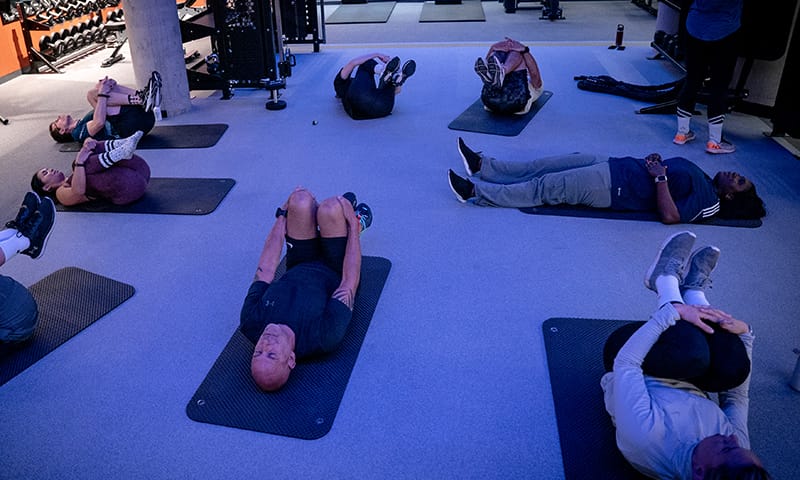 image of a group class on a floor mat